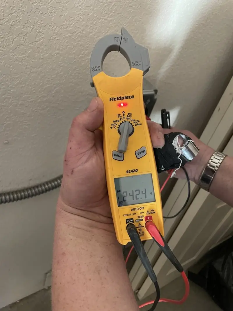 Voltage testing with clamp meter during Whole House Surge Protector in Wickliffe